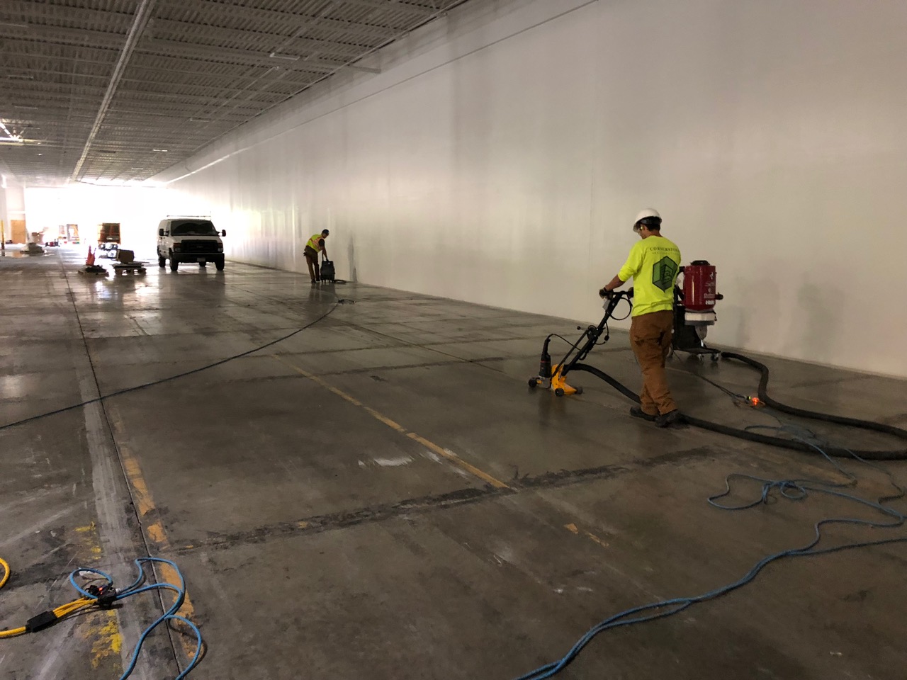 Cornerstone Restoration crew repairing Milwaukee warehouse floor