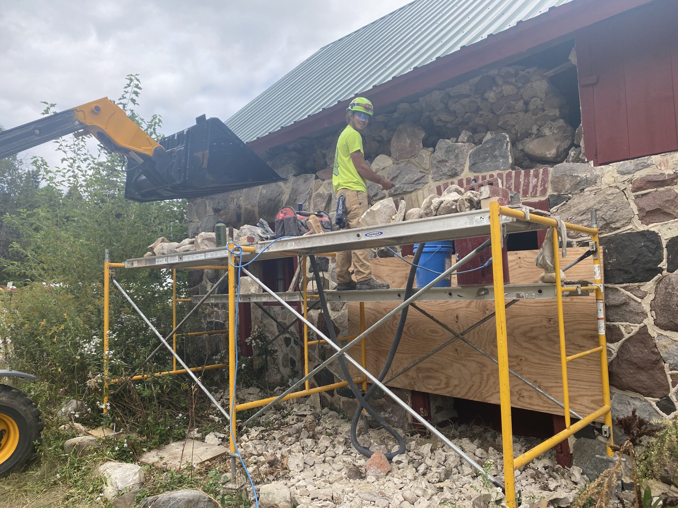 The masonry experts of Cornerstone Restoration meticulously repairing the intricate stone work at the Department of Natural Resources in Madison, Wisconsin